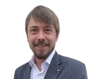 Gemeinderat Sebastian Nützl - Mann mittleren Alters mit braunem Haar und braunem Vollbart