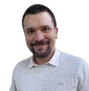 Gemeinderat Adrian Vogl - Mann mittleren Alters mit kurzen dunklen Haaren und dunklem Vollbart.